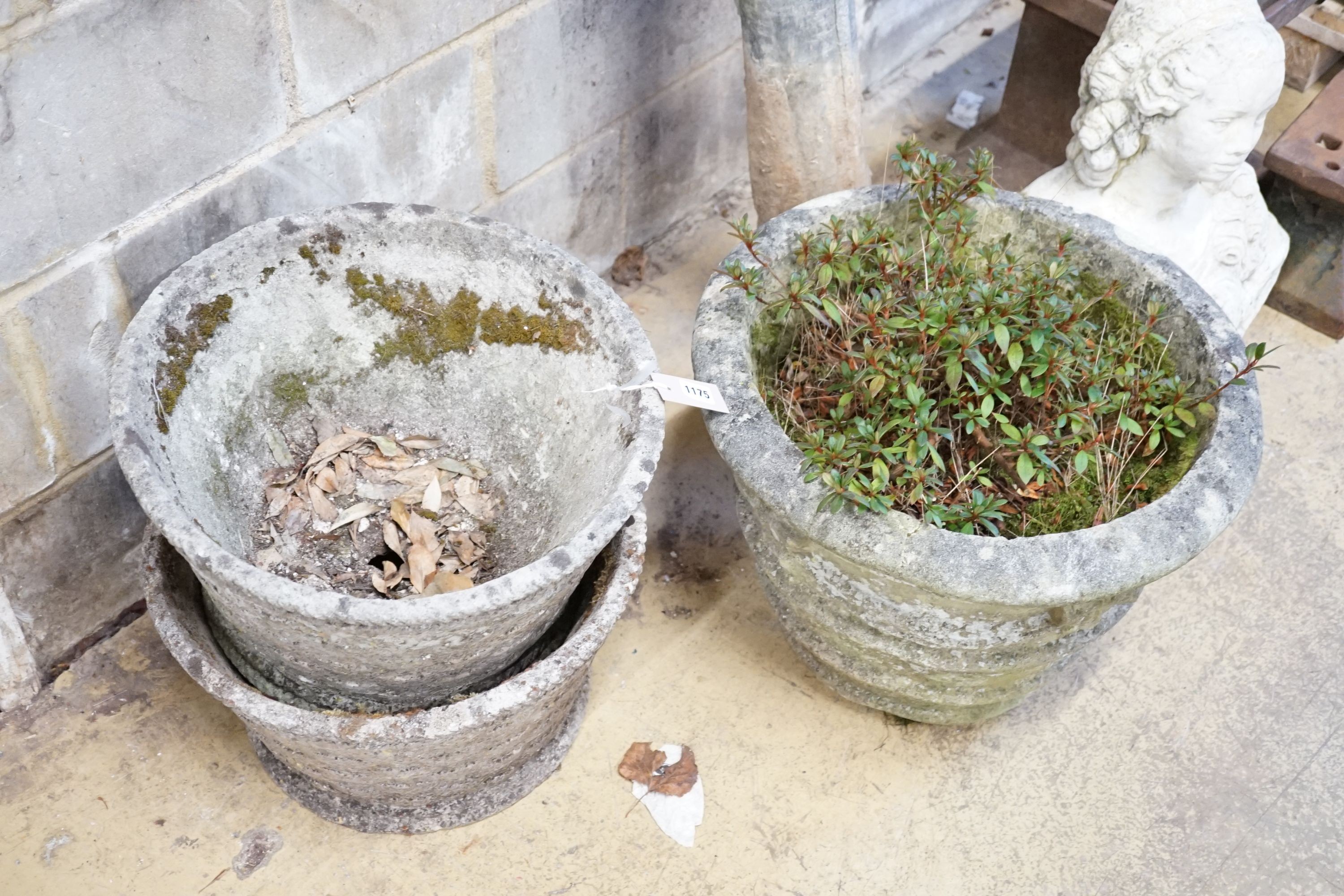 A pair of reconstituted stone basket weave garden planters, diameter 45cm and another planter, diameter 50cm